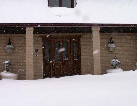door blocked by snowdrifts